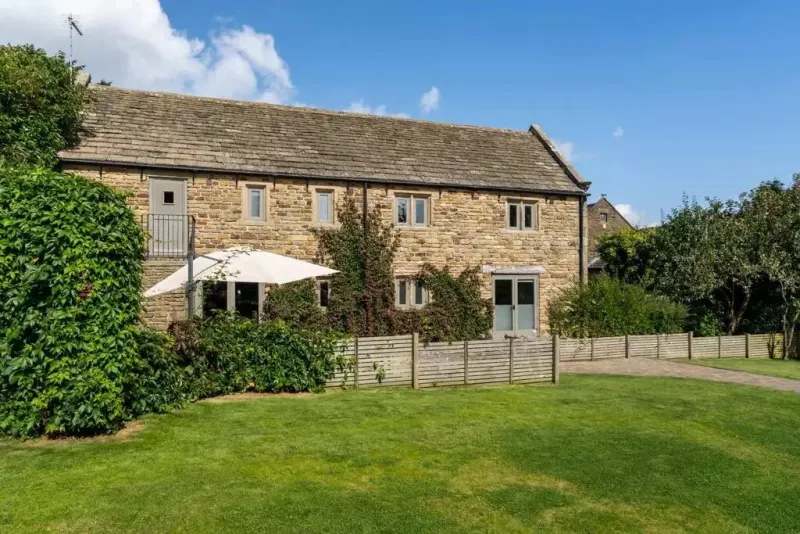 The barn and its lawn on a summer afternoon